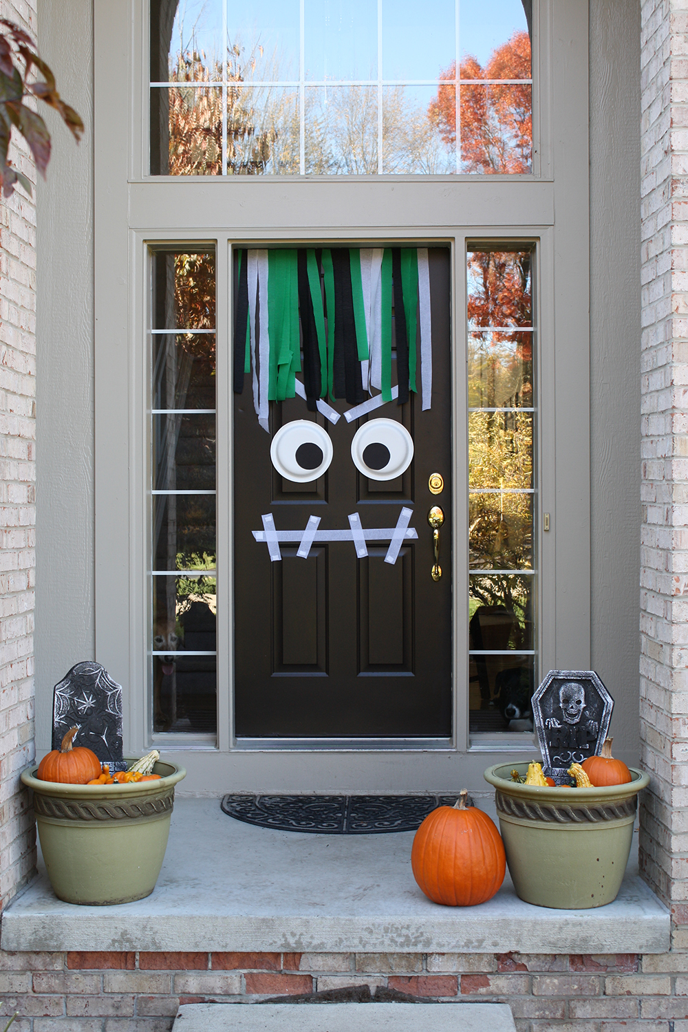 Add Some Magic to Your Apartment Door with Halloween Decor