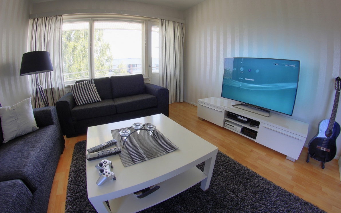 Modern gaming room with a comfortable sofa on Craiyon