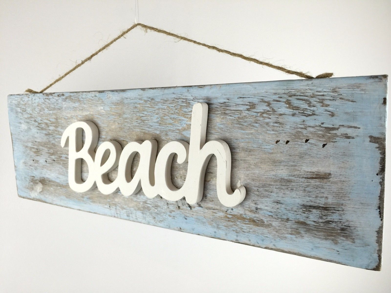 Rustic driftwood coastal sign