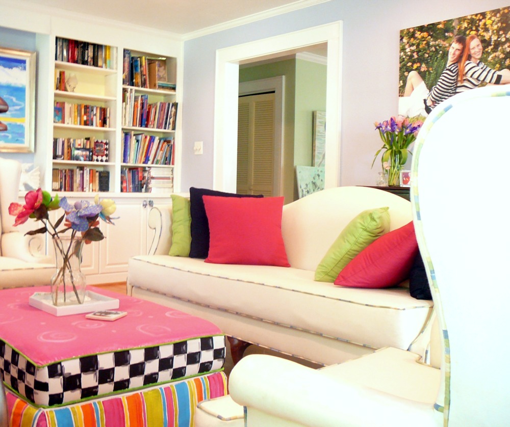 Vibrant library setting with hand painted ottoman