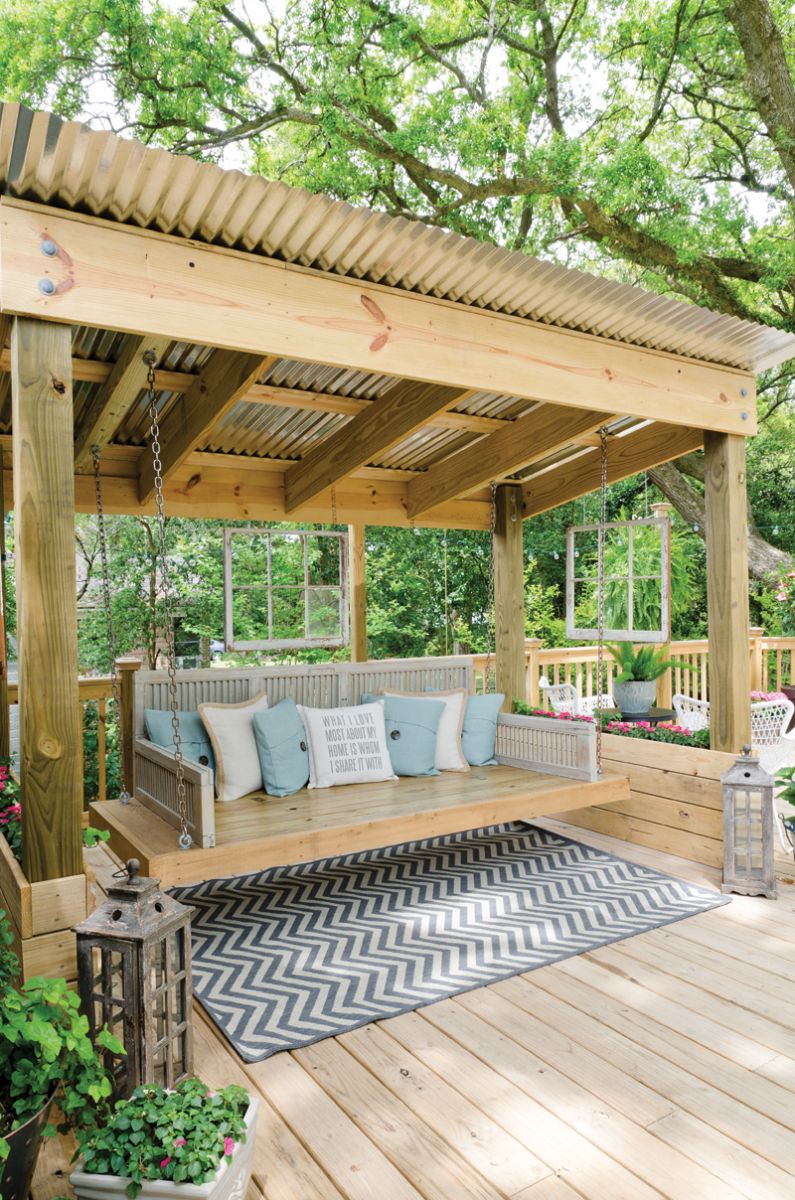 Shaded Gazebo and Lifted Polished Bench With Cushions