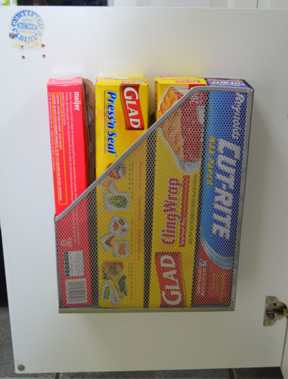 Attach a Magazine Rack Inside Cabinet Doors For Added Storage
