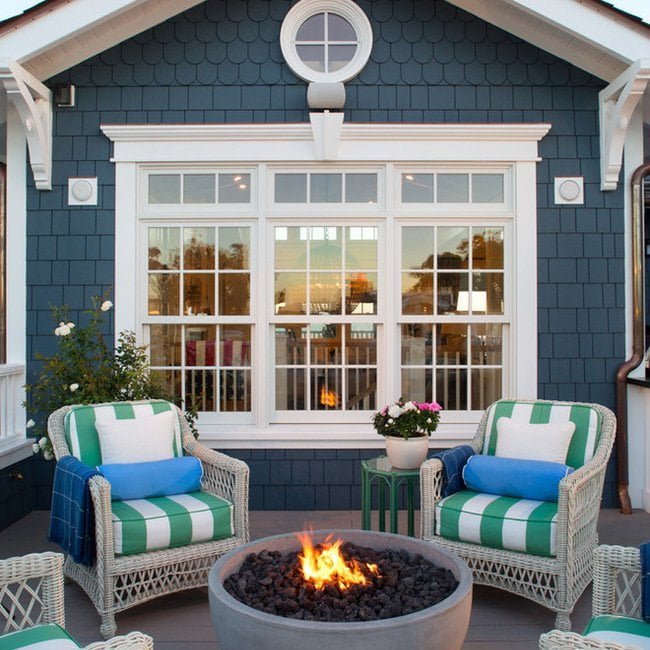 White Wicker With Bright Pillows are Perfect in This Cape Cod Style Setting