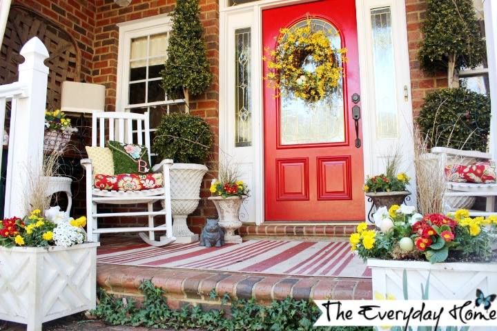 White Planters and a Wood Rocker Let the Red Door Pop