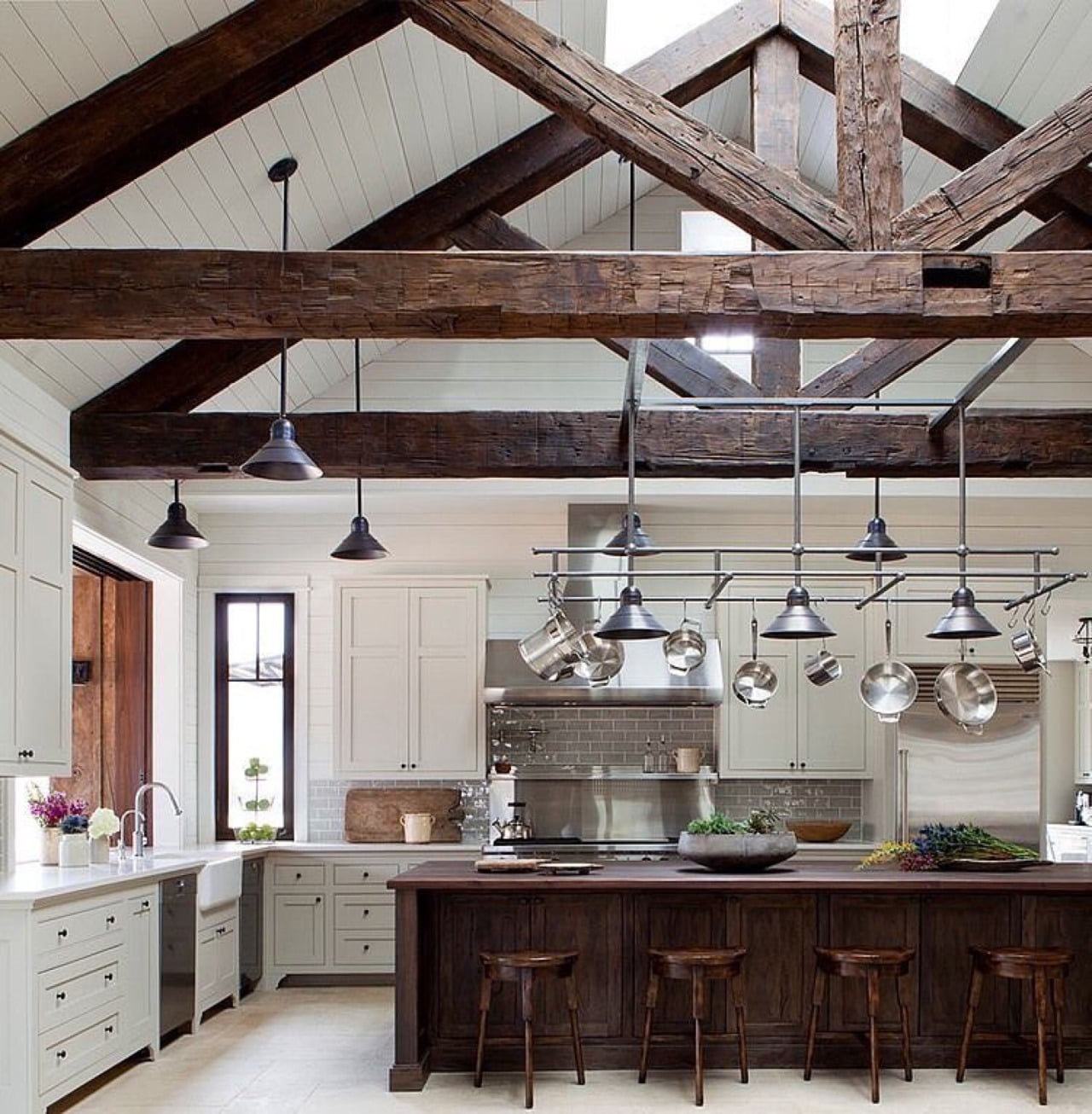 A Hefty Island Resonates with these Dominant Ceiling Trusses