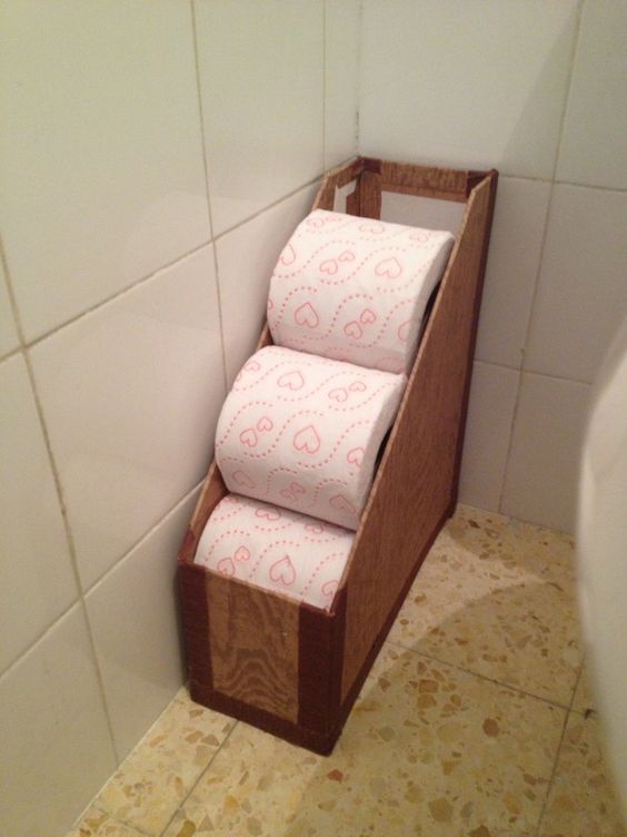 Repurposed Magazine Holder Turned Toilet Paper Storage