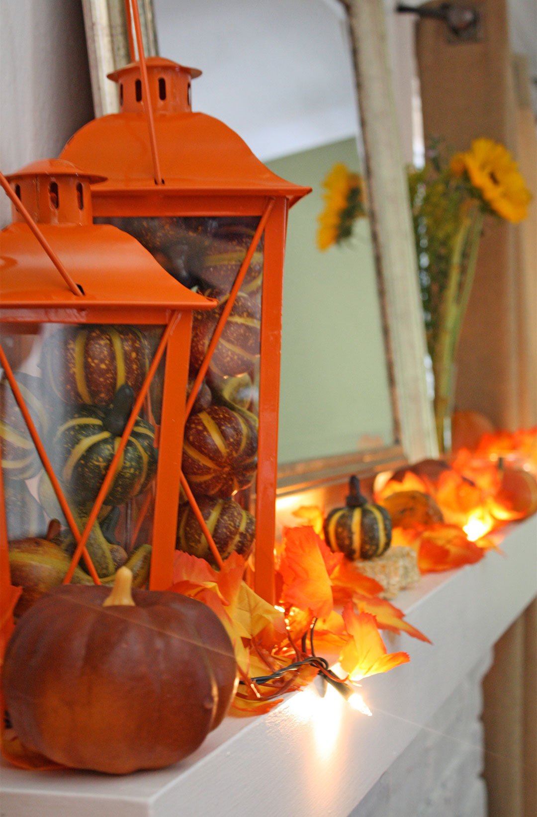 Orange Glow and Lanterns Light this Mantel