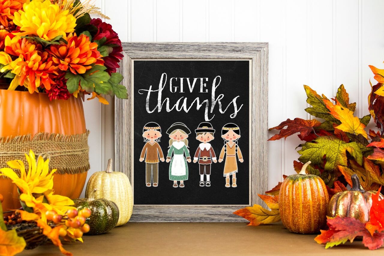 Thanksgiving Figures on Chalkboard with Pumpkins and Fall Foliage