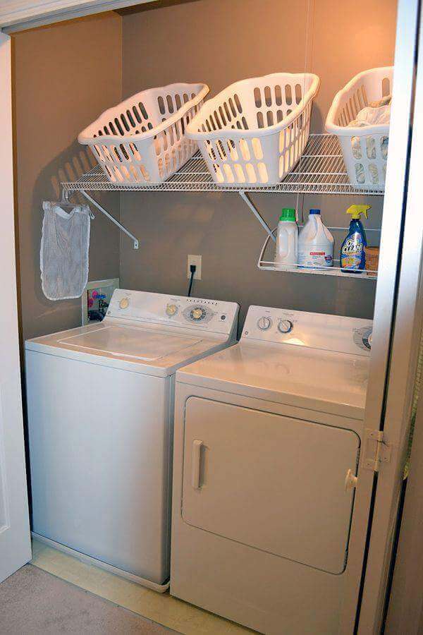 Angled Shelving Conveniently Holds Laundry Baskets