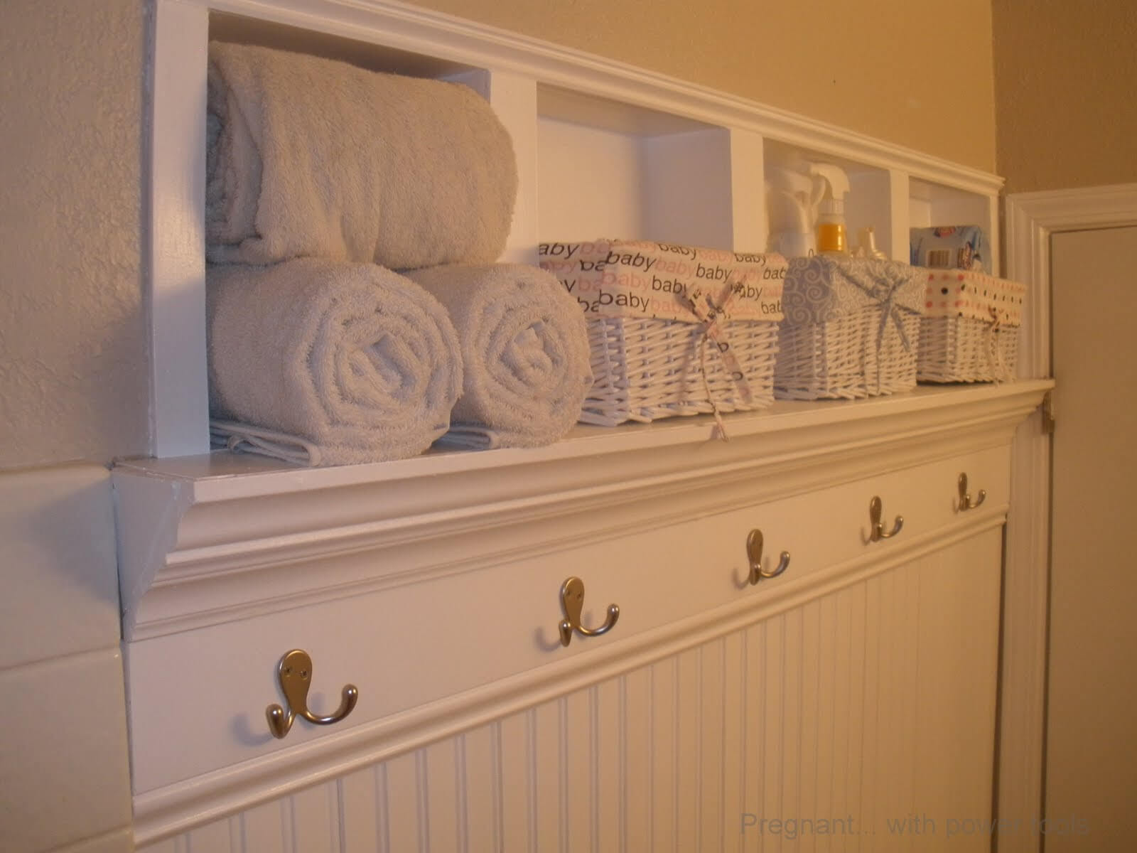 bathroom wall shelf with hooks