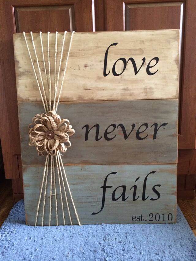 "Love Never Fails" Tri-Color Weathered Wood Sign