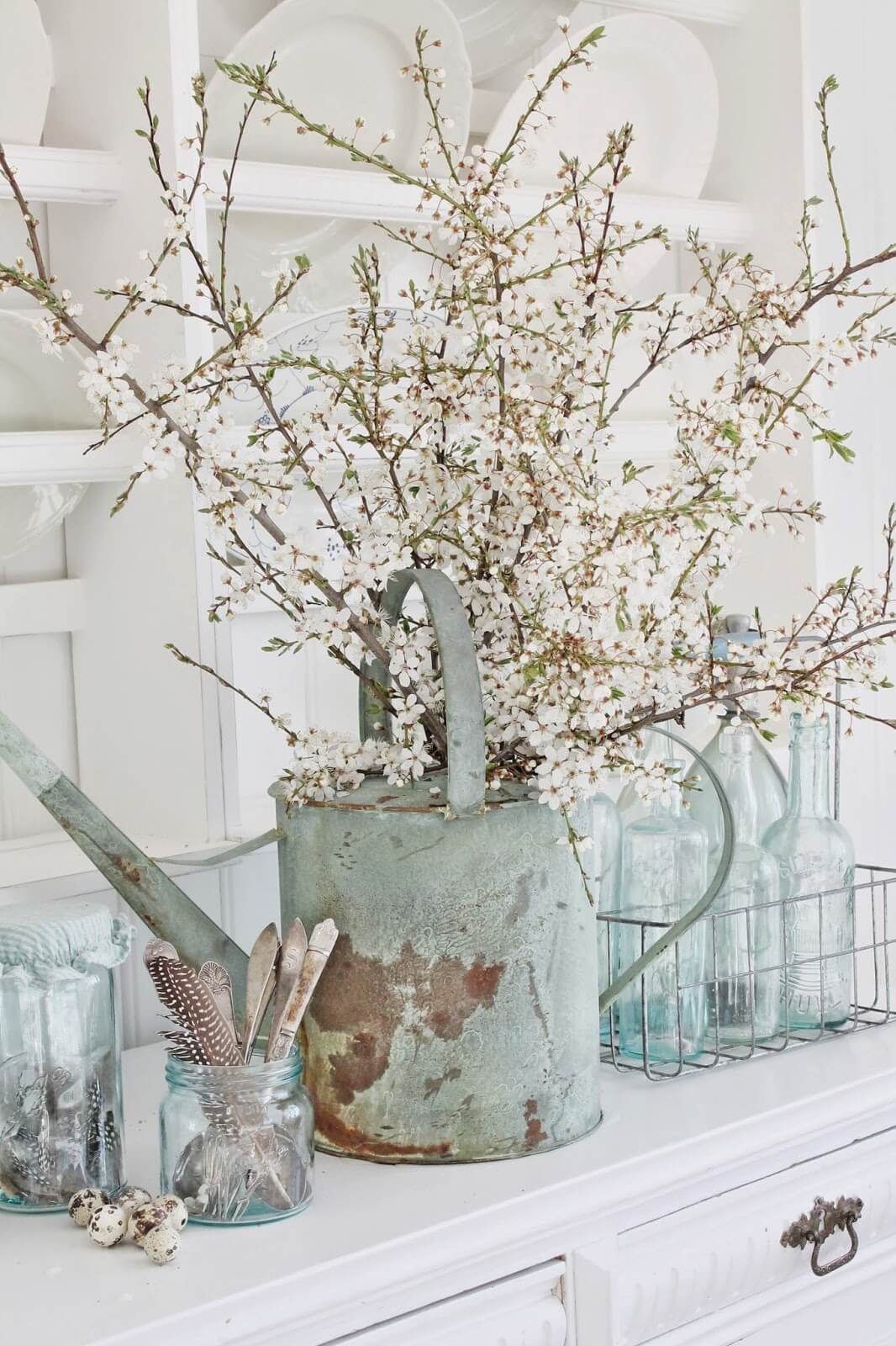 A Wintery Centerpiece with Spring Feathers and Eggs