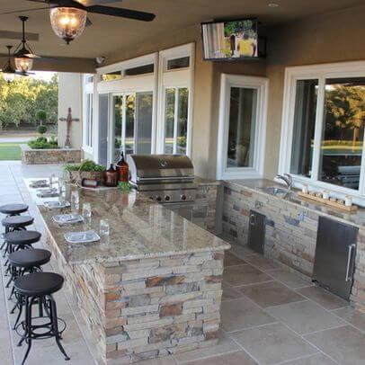 outdoor bar with fridge and sink