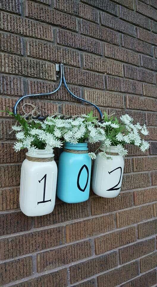 A Hanging Floral Arrangement with Milk Jugs