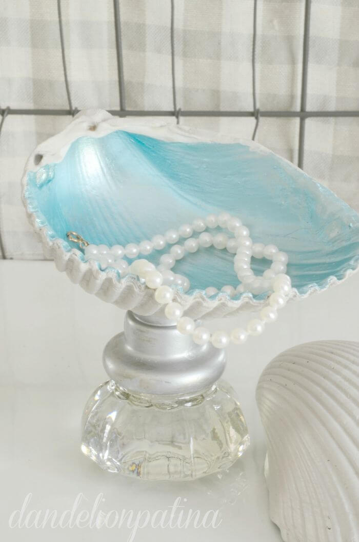 A Blue Clam Shell Jewelry Stand