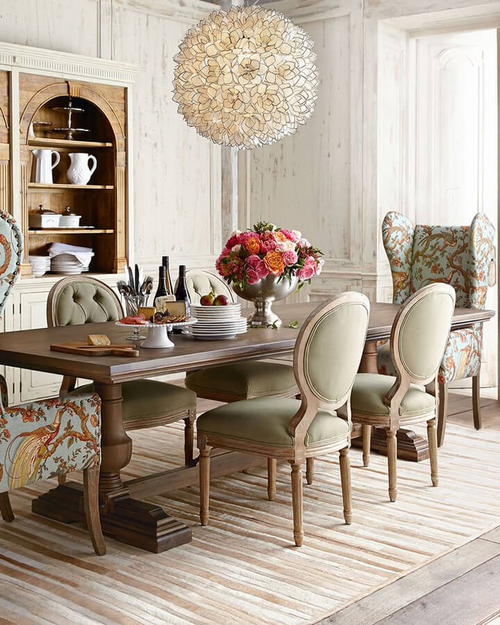 High-Ceilinged Dining Room with Fanciful Chairs