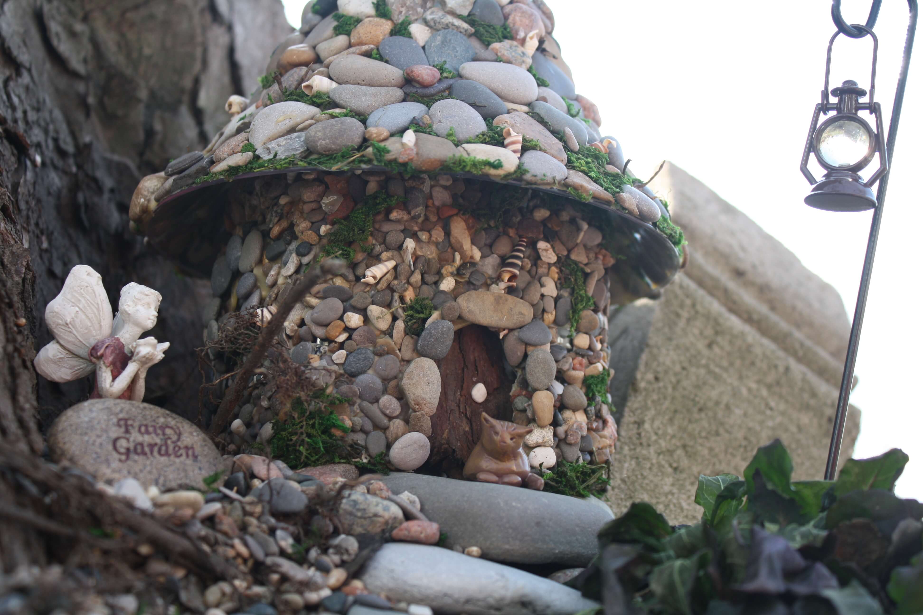 DIY Pebble-Pasted Bottle Fairy House