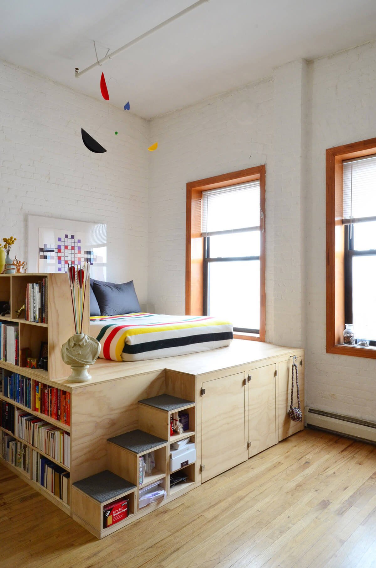 An Elevated Bed with Shelving and Storage — Homebnc