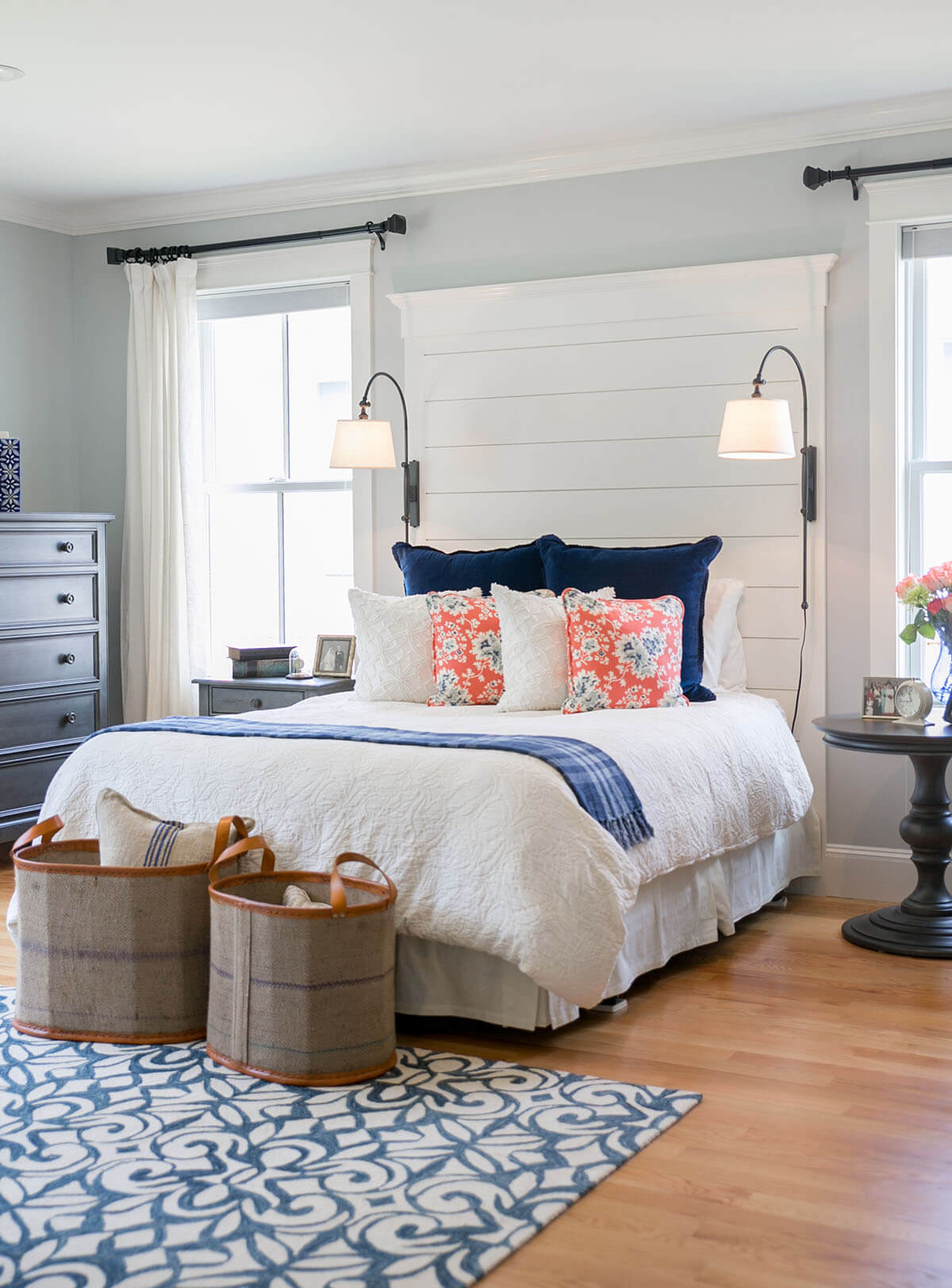 A Quaint Bedroom with Bright Accent Pillows