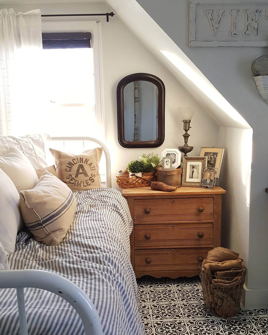 A Comfy Bed with a Small Dresser