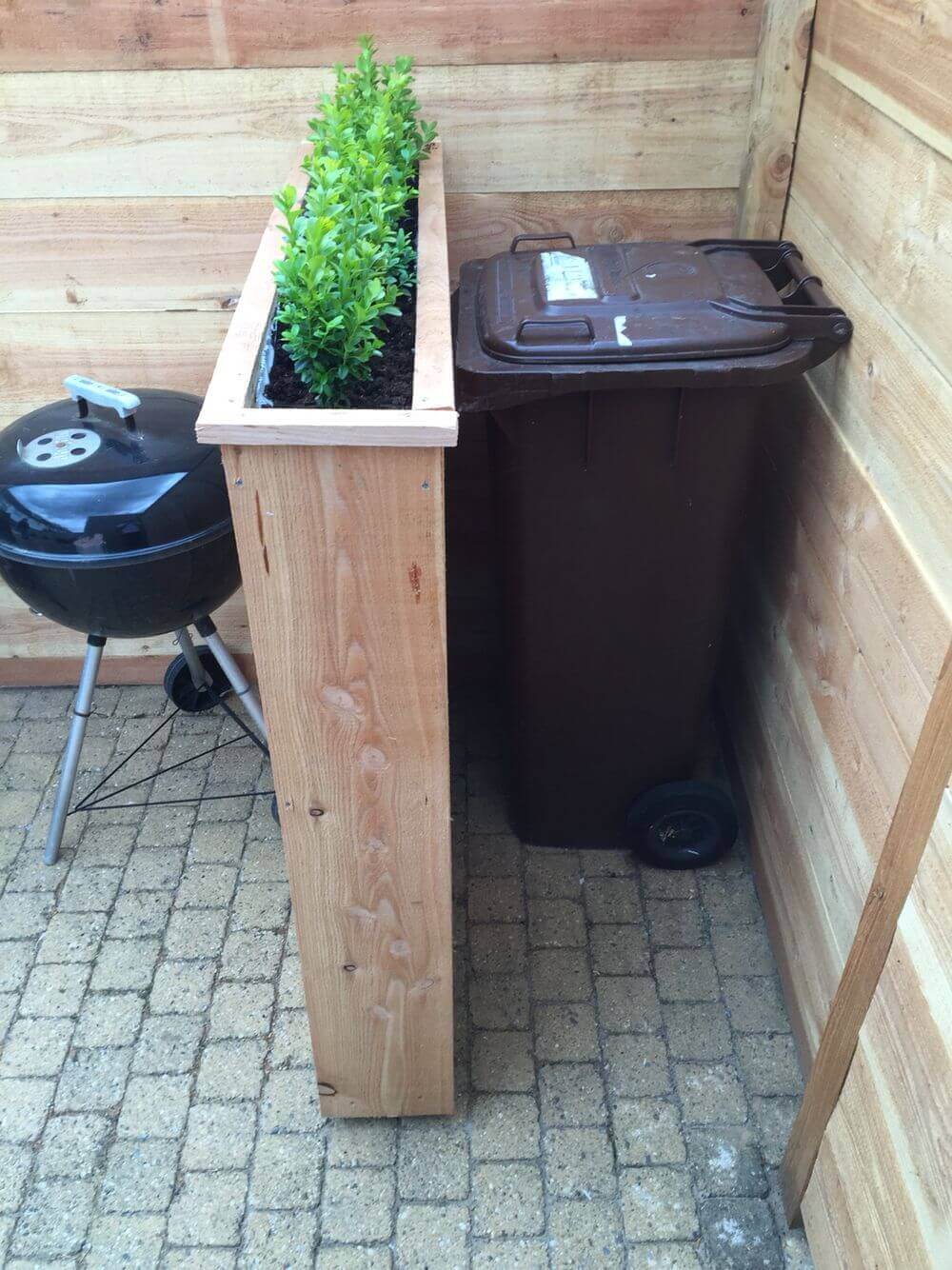 Lovely Raised Planters Hide Unsightly Bins