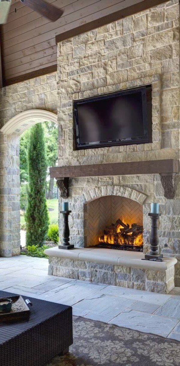 Natural Stone Fireplace Warms Outside Space