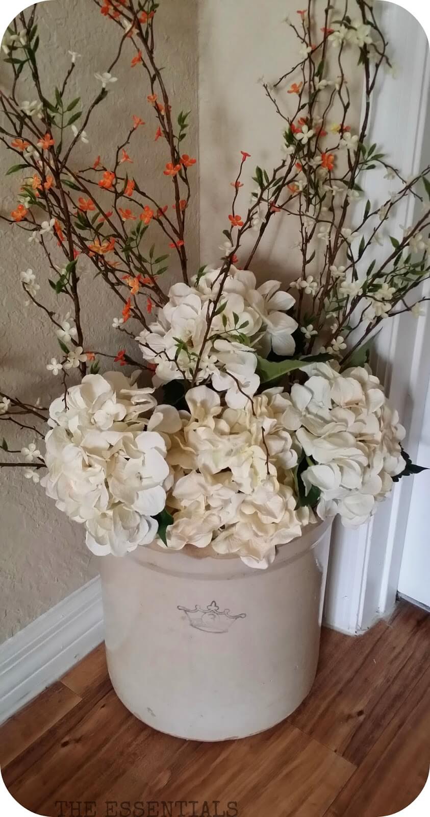 Arranging Flowers in Stoneware Crocks