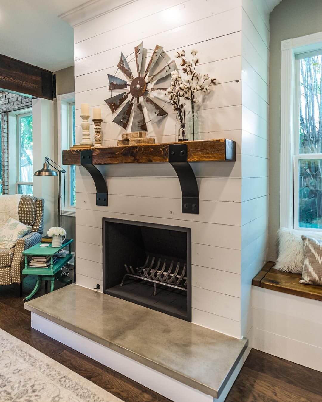 Exposed Beam Mantel with Windmill Wall Art