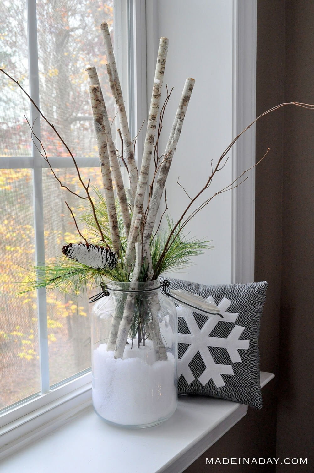 Unexpected Birch Sticks in Snow Arrangement