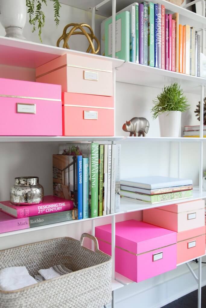 Color Coordinated Storage Boxes On A Bookshelf