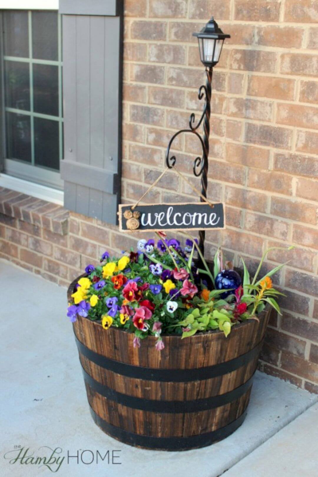 Flower Barrel, Lamp Post and “Welcome” Sign