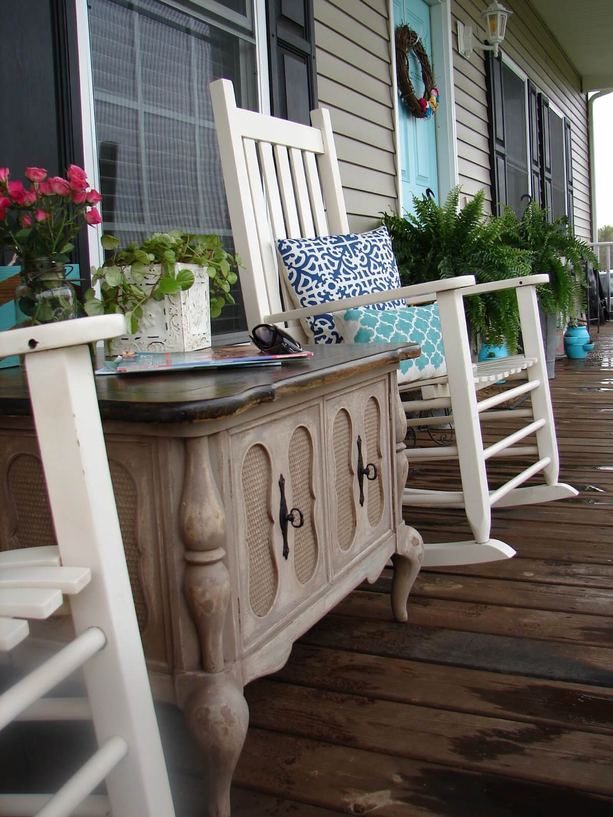Wooden Table, Rocking Chairs, and Patterned Pillows