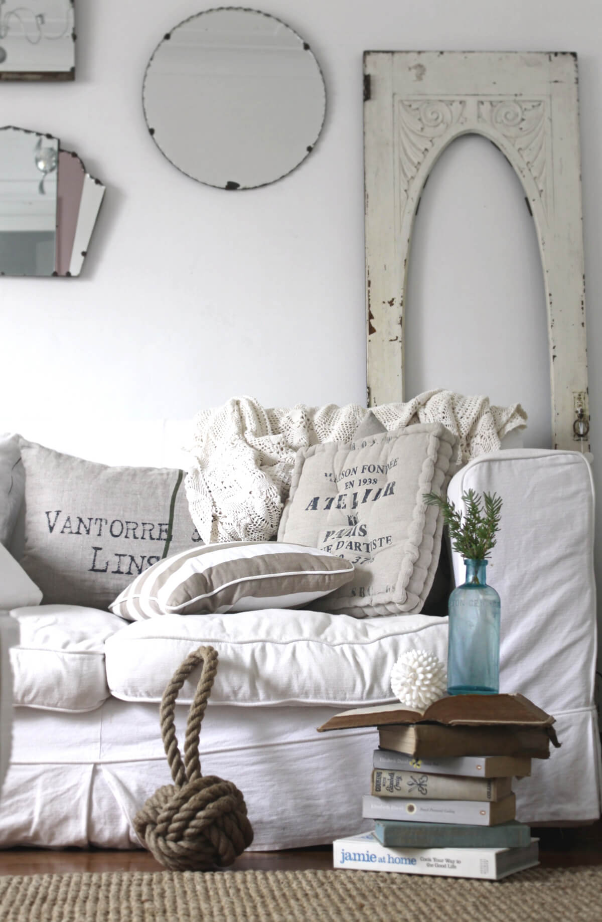 White Sofa with Oversized Cushions and Nautical Knot