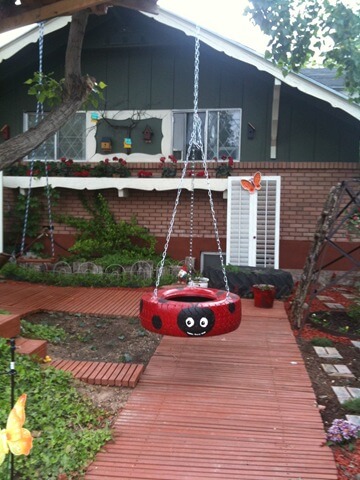 A Ladybug Tire Swing with a Smile