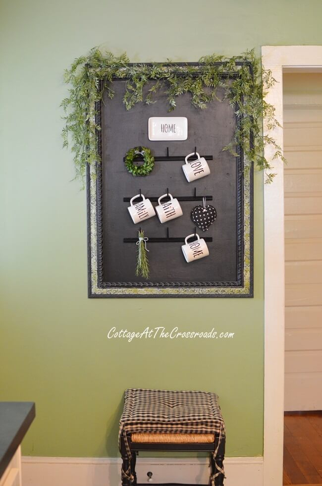 Framed Arrangement with Hooks and Greenery