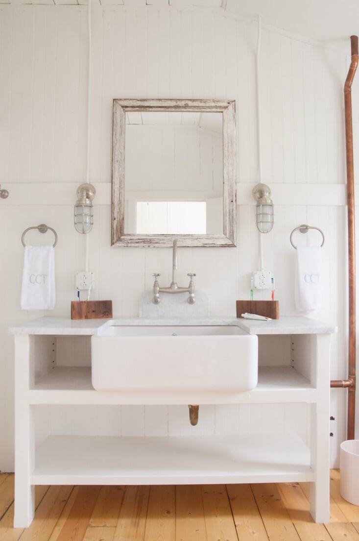 Distressed Wood Mirror with Clean White Vanity