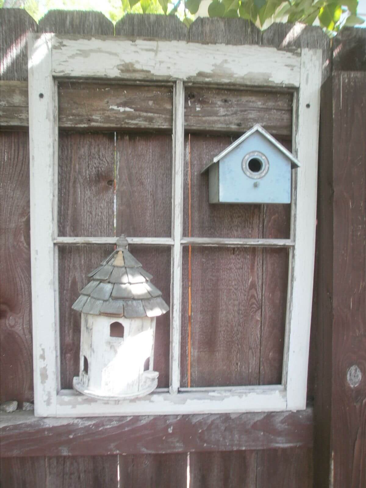 Frame a Cute Birdhouse on the Fence