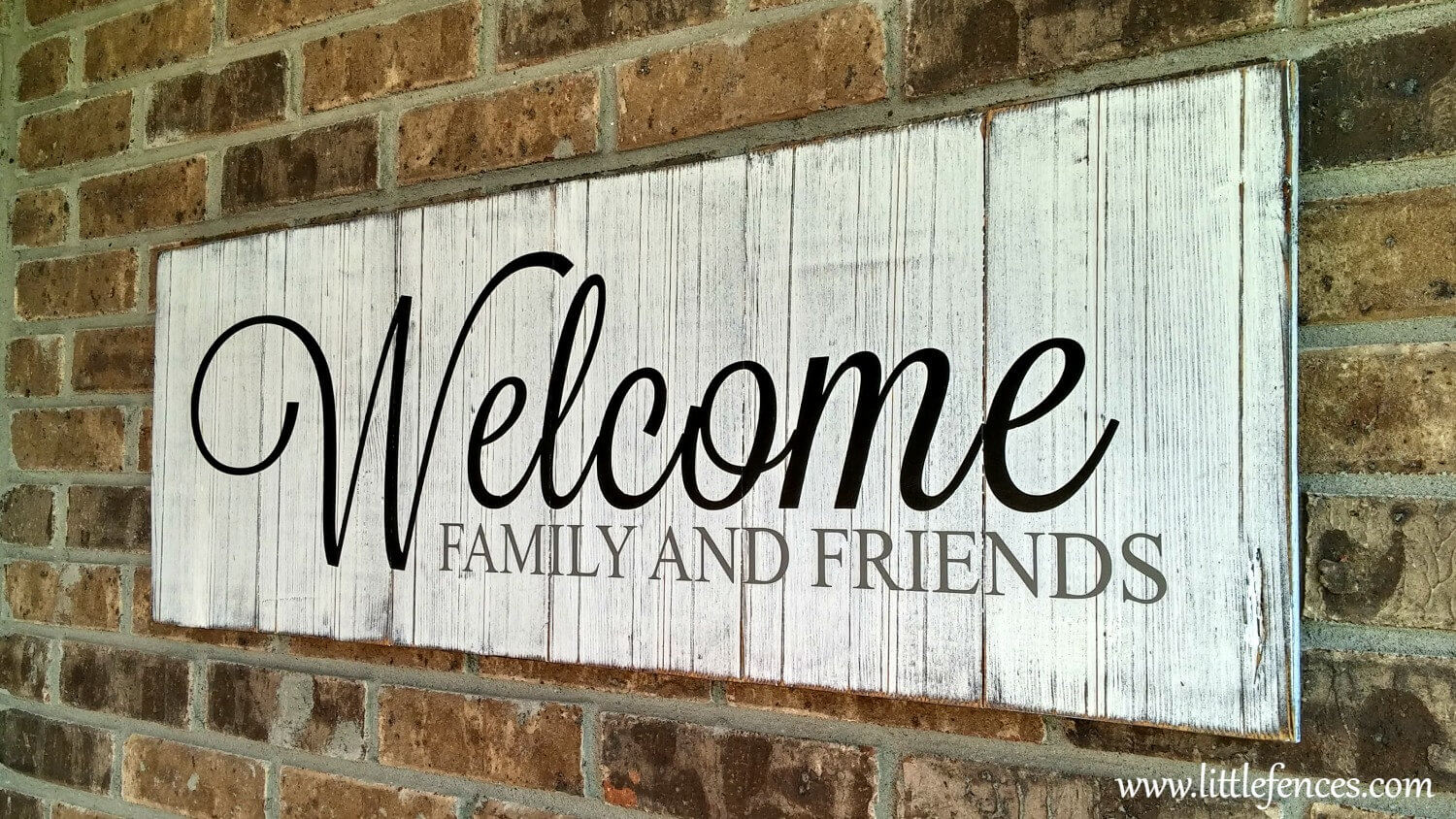 Simple White Painted Welcome Sign