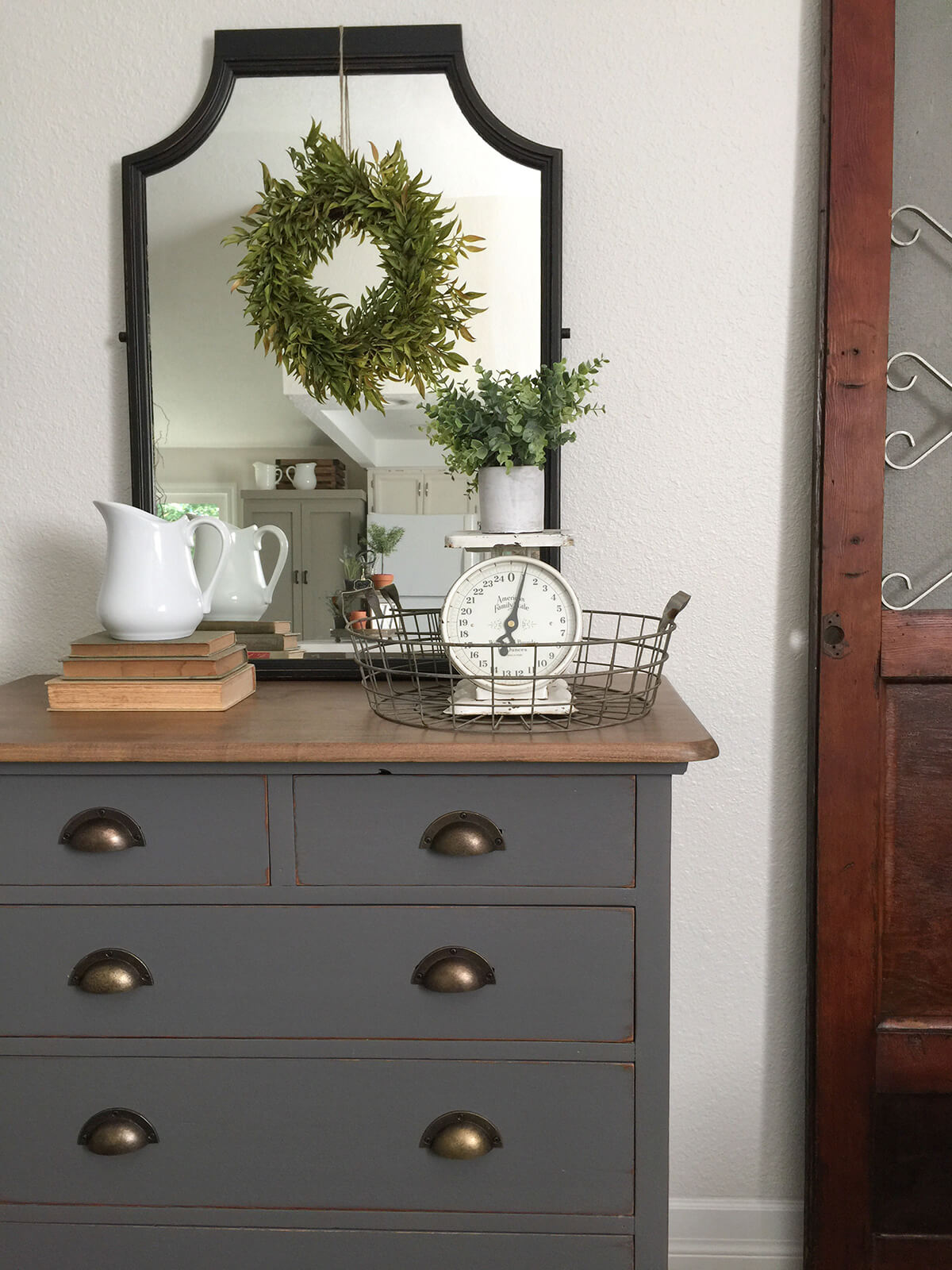 Simple Mirror with a Hanging Wreath