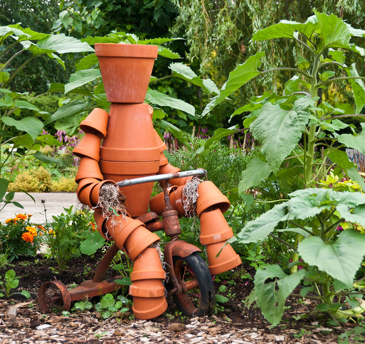 Clay Pot Kid Riding a Tricycle