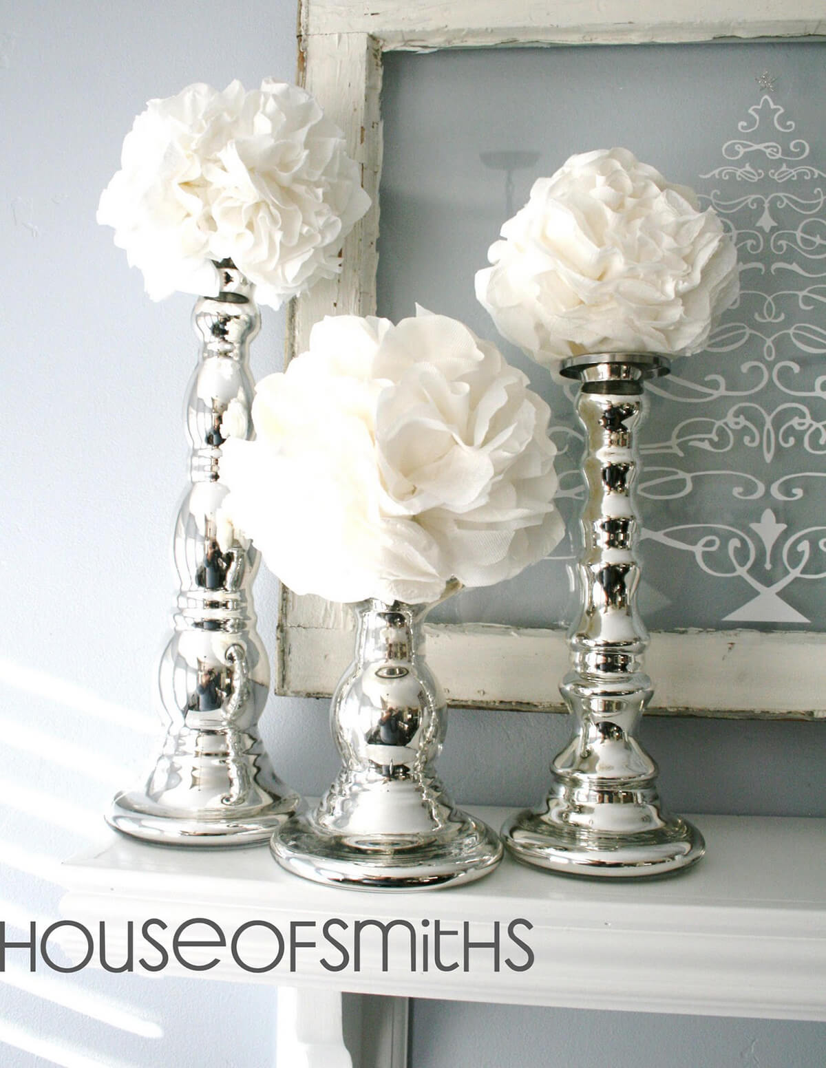 White Flowers Blossoming from Silver Candlesticks