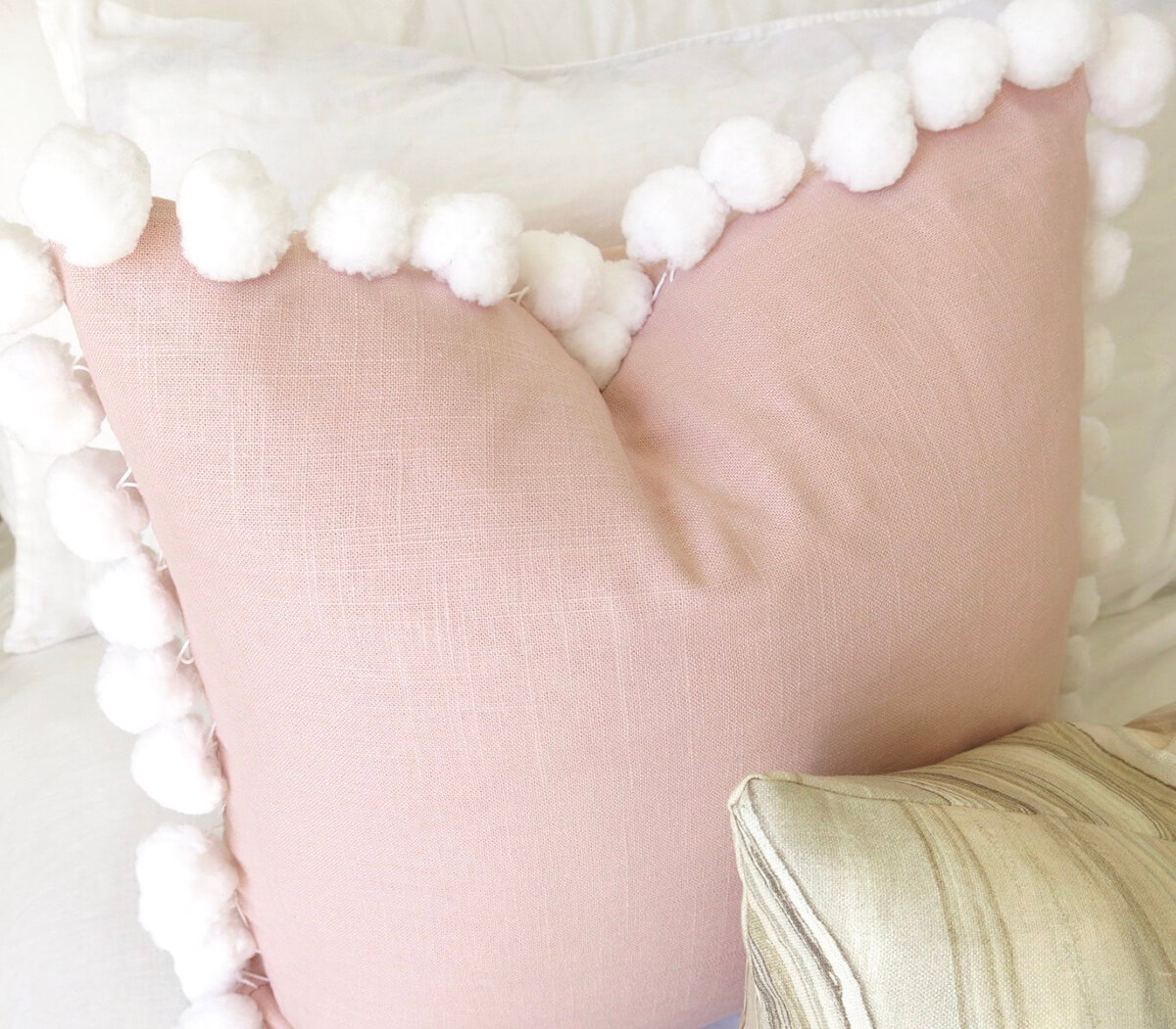 Whimsical Pink Pillow Edged with Puffballs