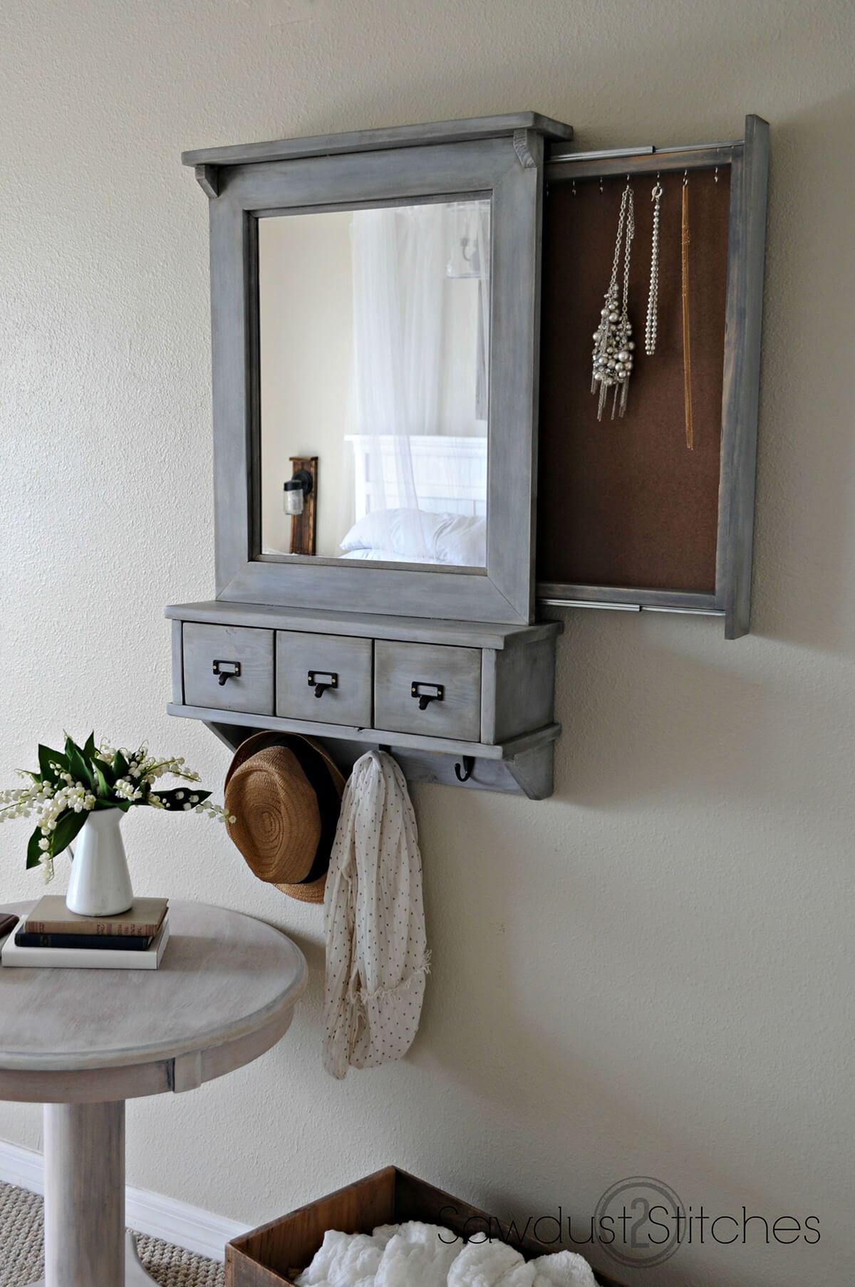 A Wall Mirror with Three Storage Areas