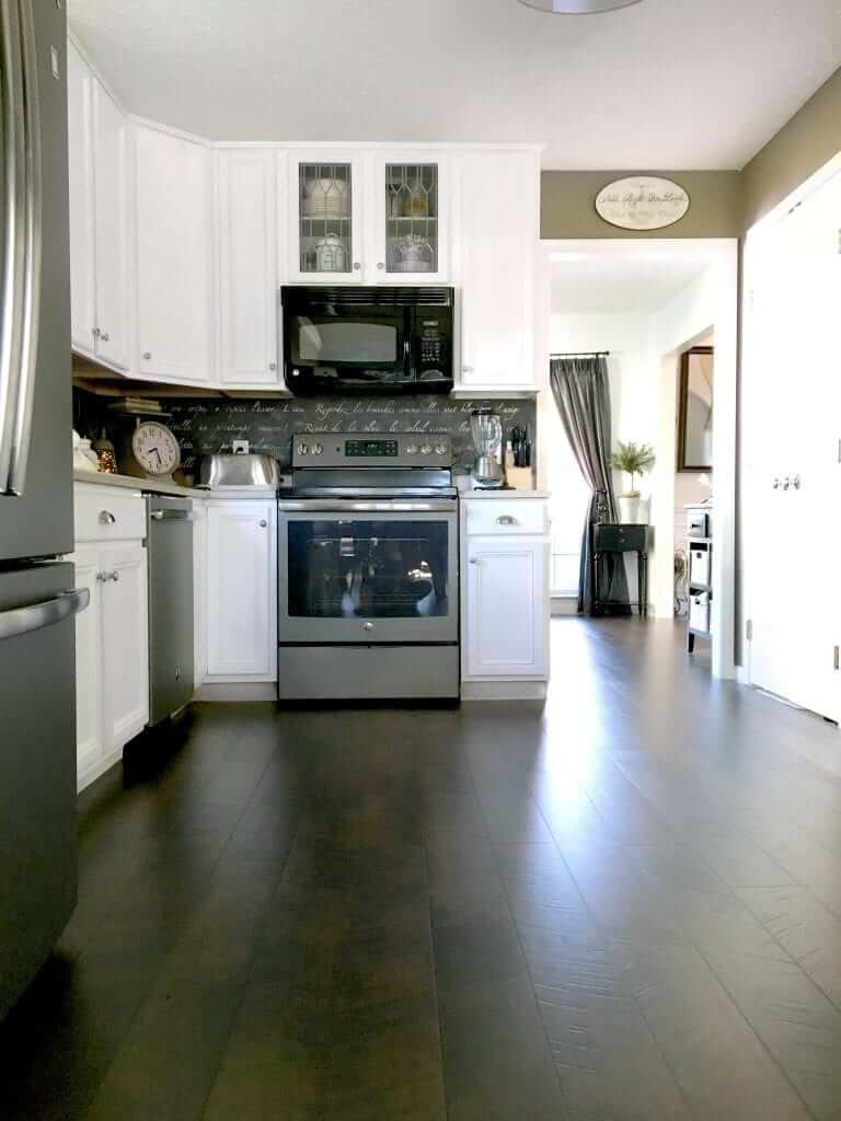 Sleek and Dark Pergo Kitchen Flooring Design Idea