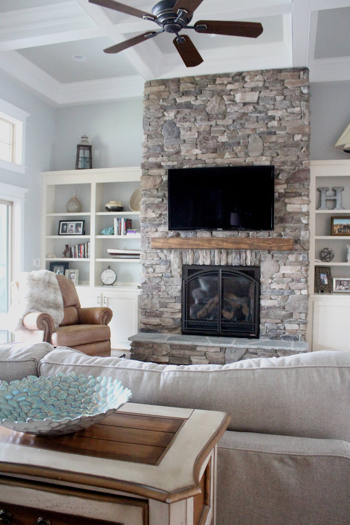 Impressive Rustic Stacked Stone Floor-to-Ceiling Fireplace