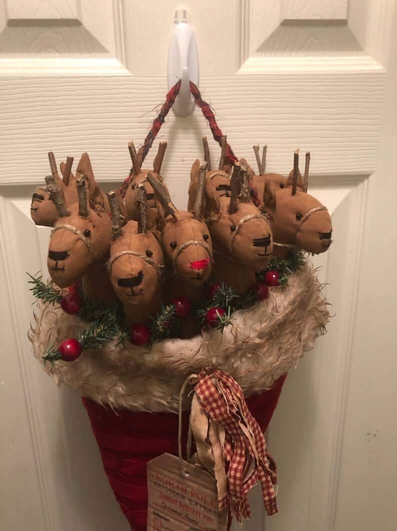 Primitive Reindeer Nestled Inside a Santa Hat