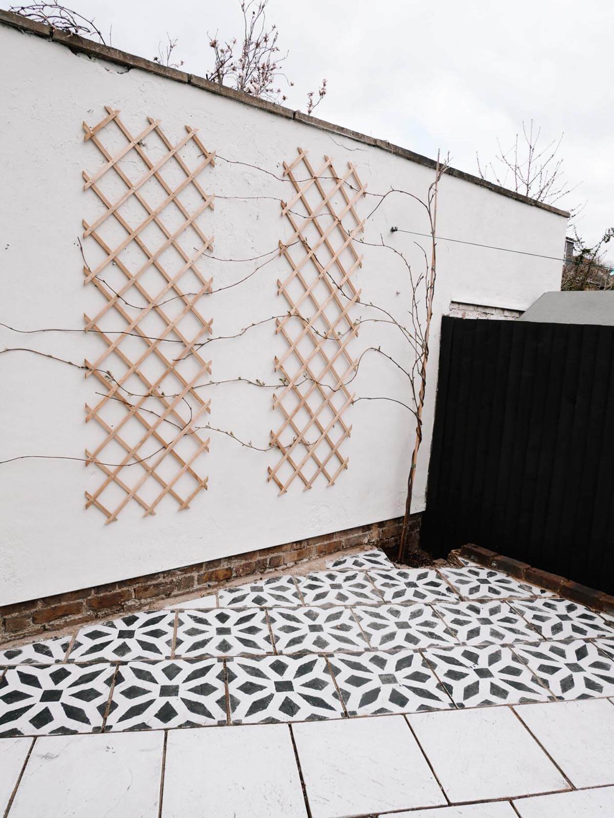 Stenciled Geometric Flowered Black and White Outdoor Tile