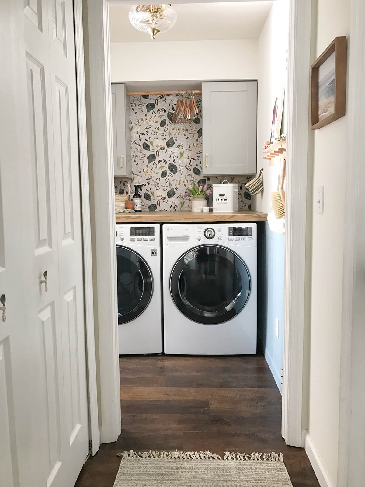 Wallpaper and Gorgeous Lighting Laundry Nook