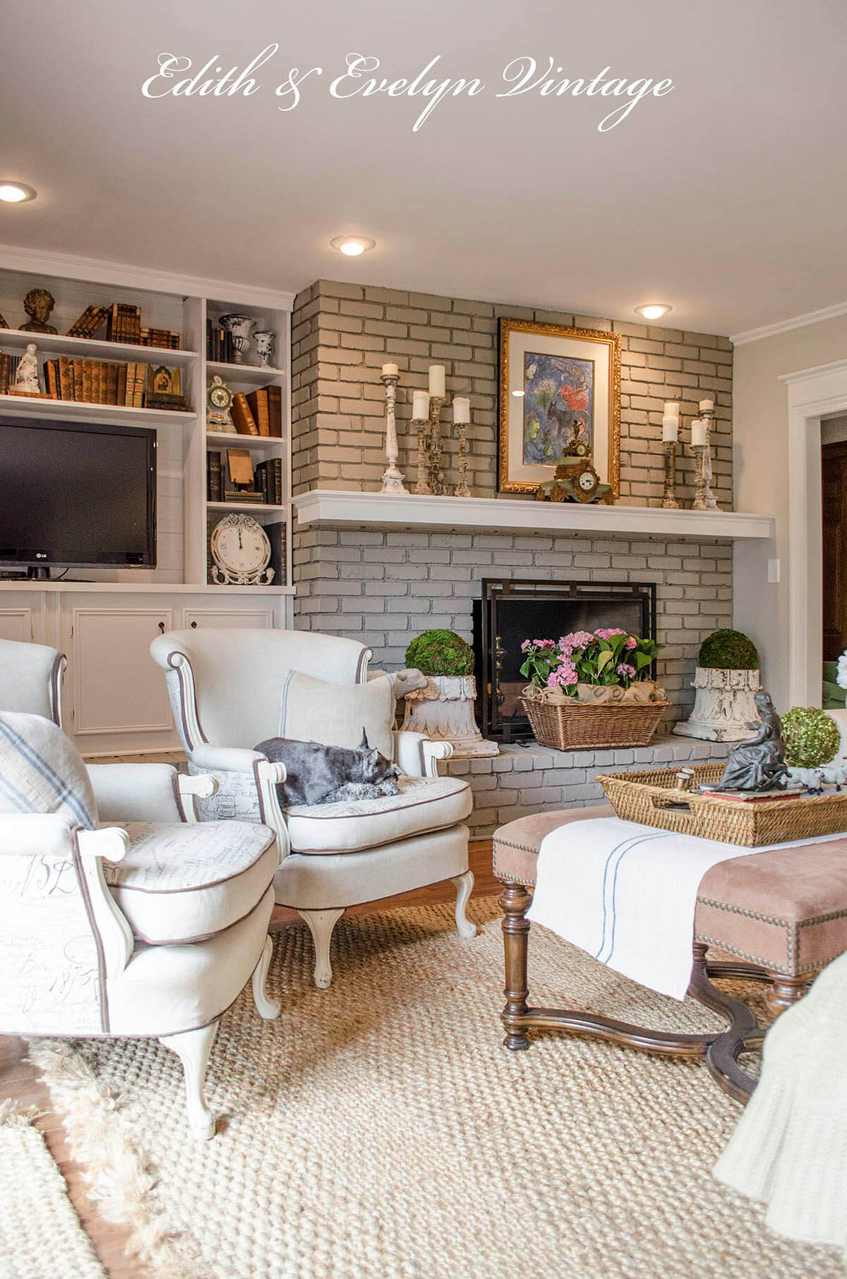 living room with brick fireplace