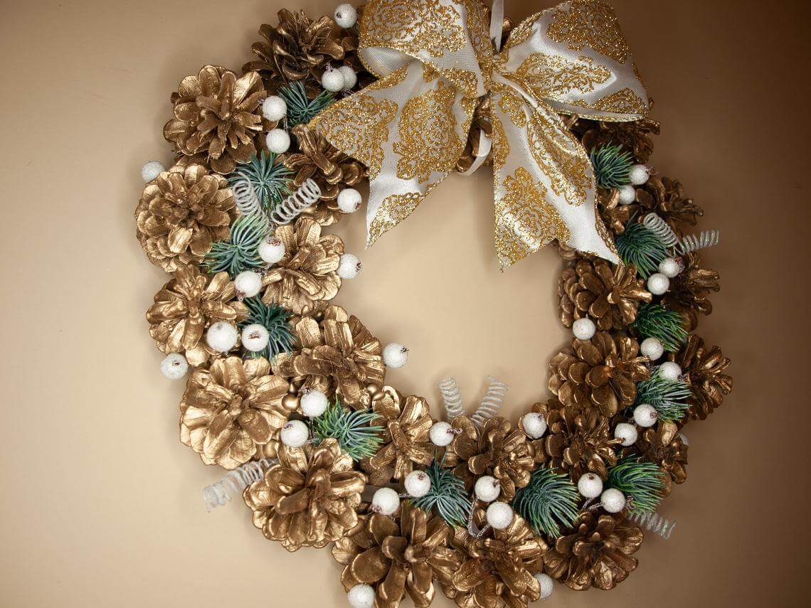 Golden Pine Cone Wreath with a Bow